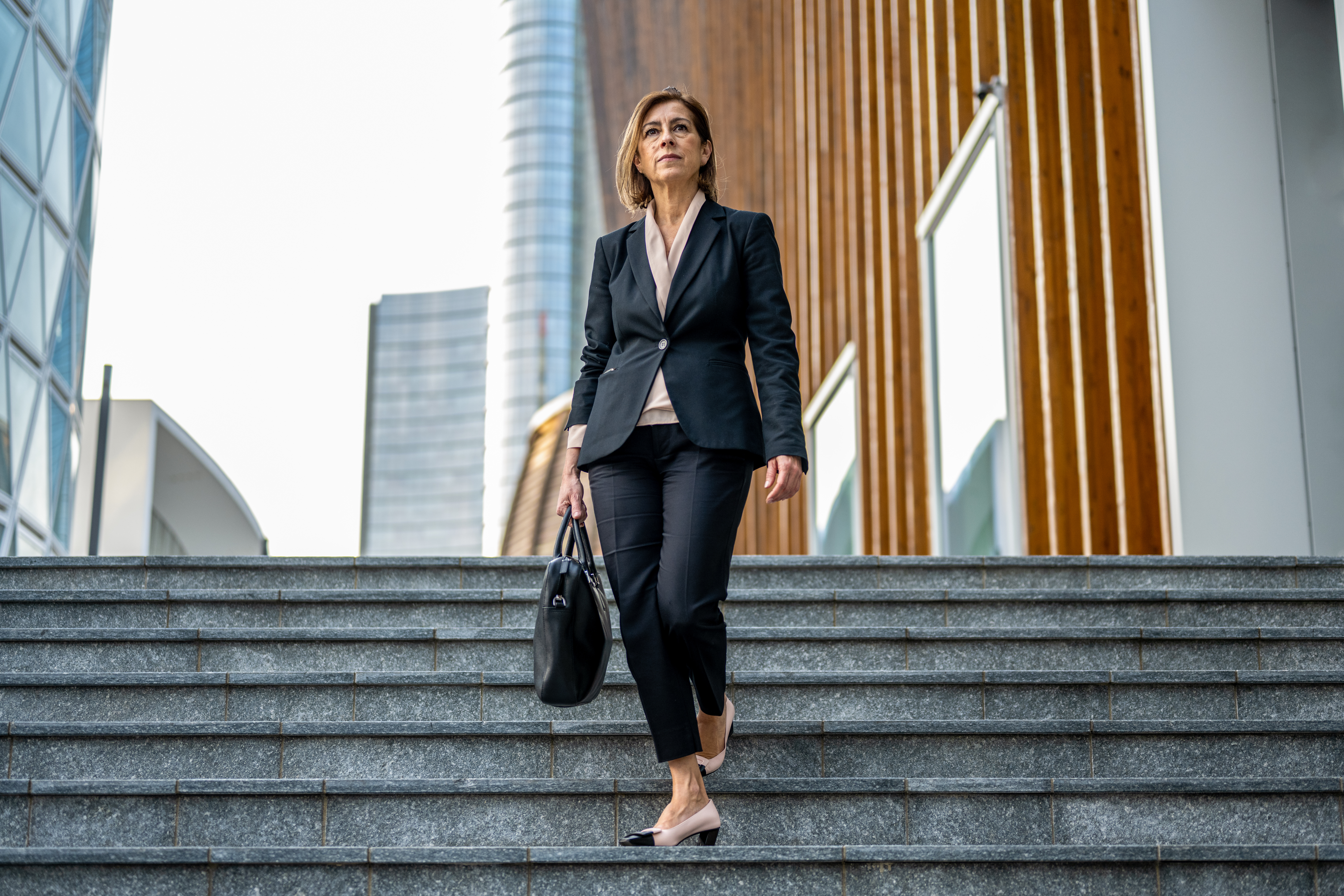 businesswoman walking down steps