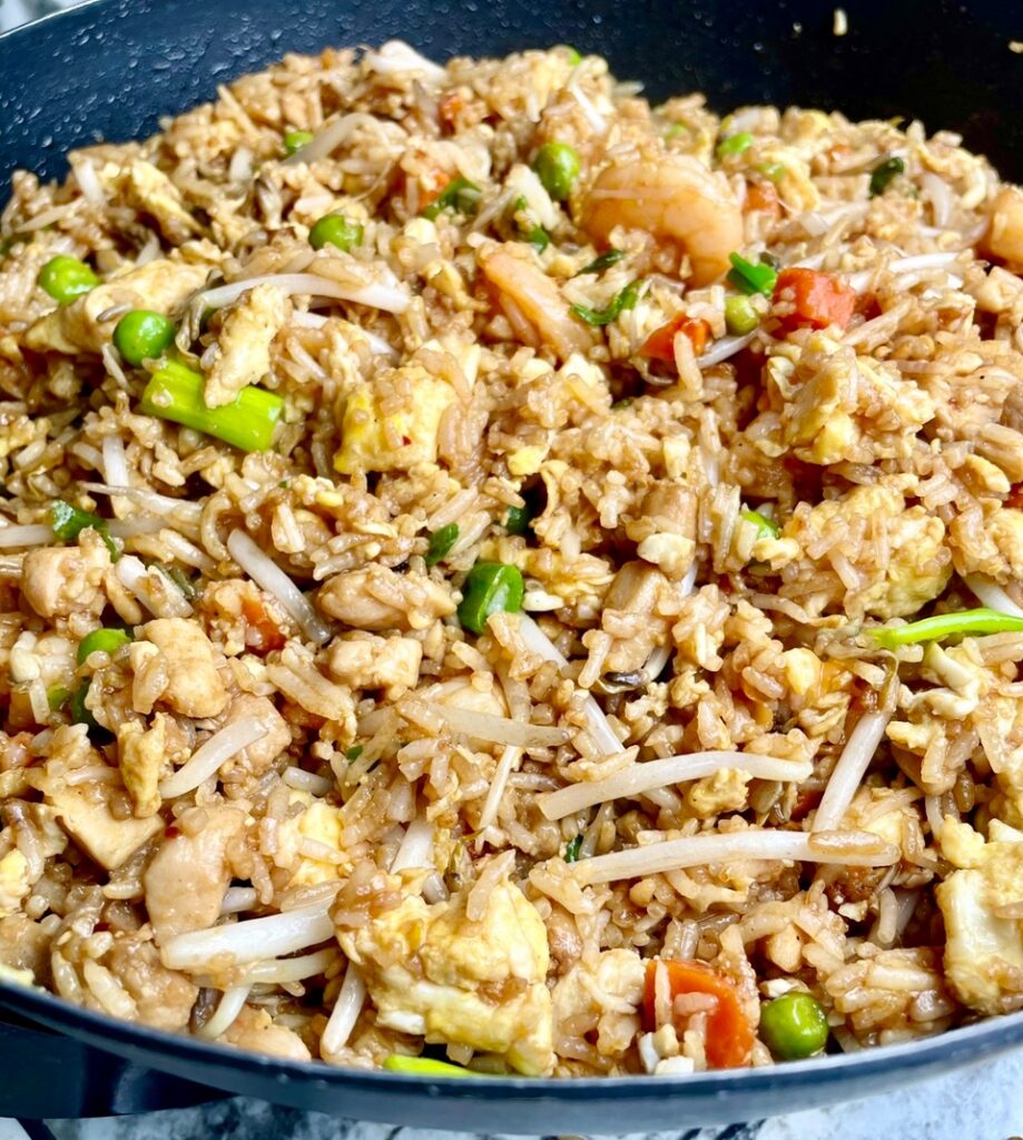 chicken and shrimp fried rice on a serving plate