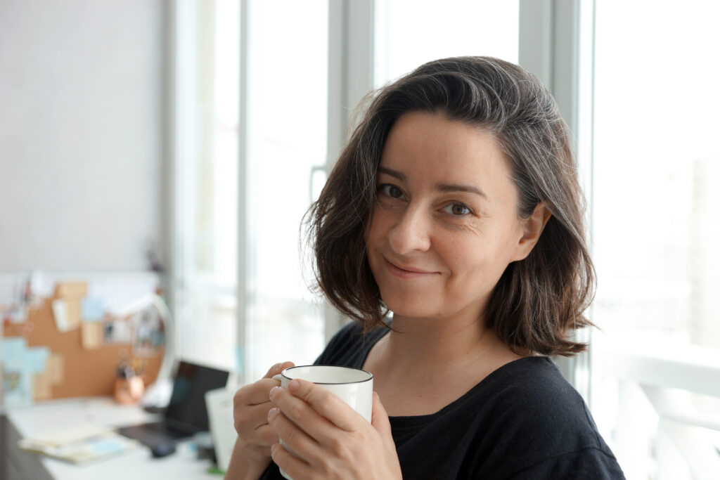 Portrait of a woman against home office background