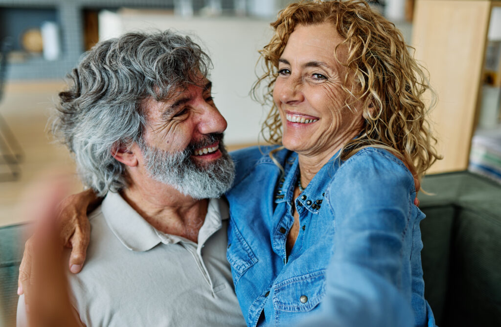 senior woman man couple elderly love elderly selfie camera mobile phone smartphone photo picture portrait male old together active vitality cell phone hug